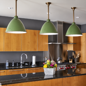 Storehouse VA1C0321 vintage pendant light with a green enamel shade installed above wood framed windows