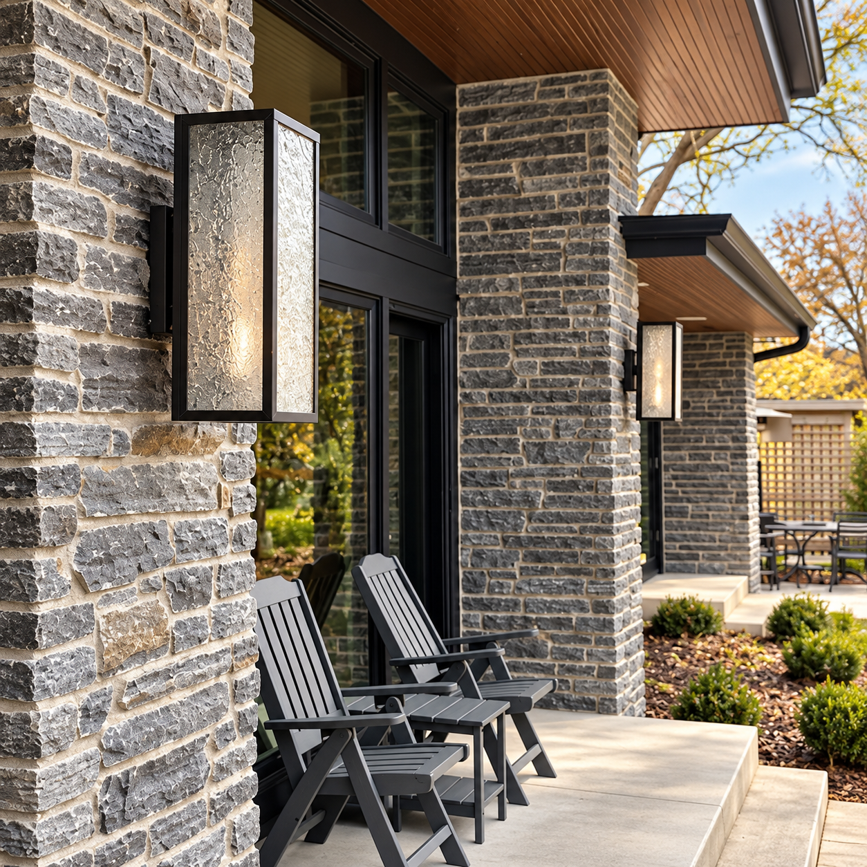 Delray EX-8008-A10 outdoor wall sconces installed on the stone columns of a covered residential patio