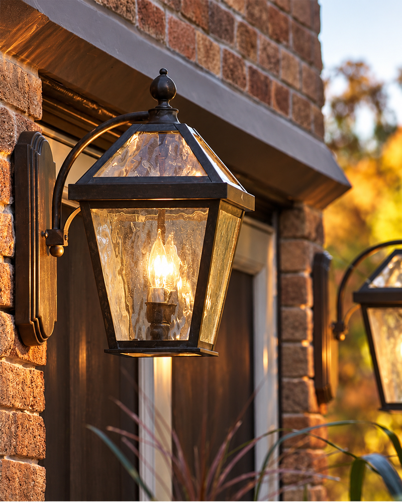 London EX-5708-A12 curved arm brass outdoor wall lantern with Verdigris Patina and Waterfall art glass installed on a brick entry