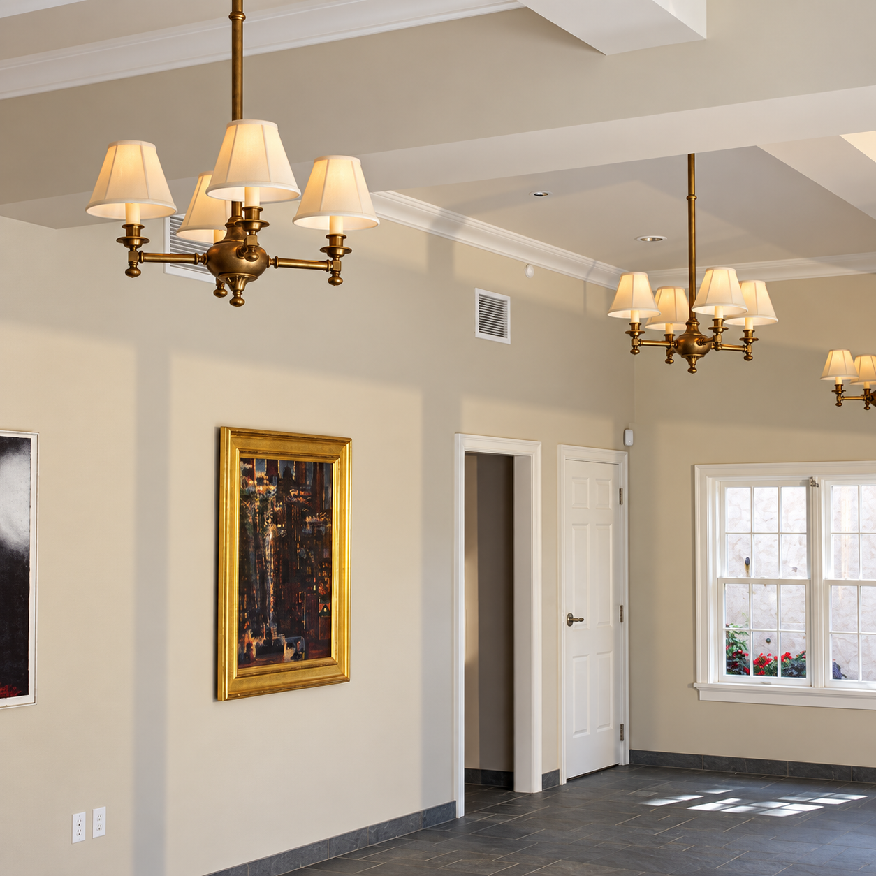 Three Morris CN-524-K2-09M four light solid brass chandeliers with fabric shades installed in an art gallery